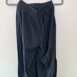 Black flowy relaxed cut pants by FAVLUX